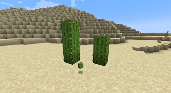 A person typing on a laptop with a blank screen.