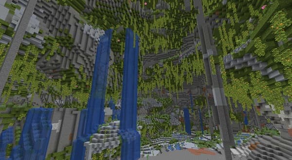 Man coding on a laptop with lines of code.