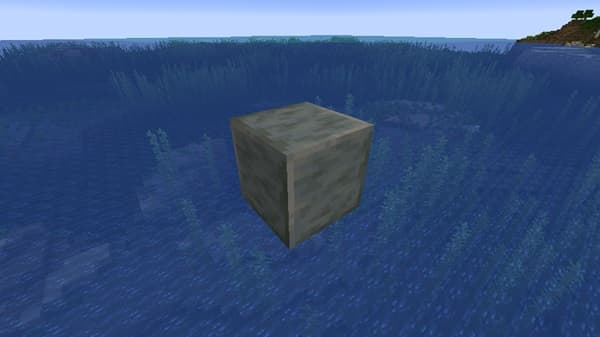 A tranquil, fog-covered landscape at dawn, with trees emerging from the mist.