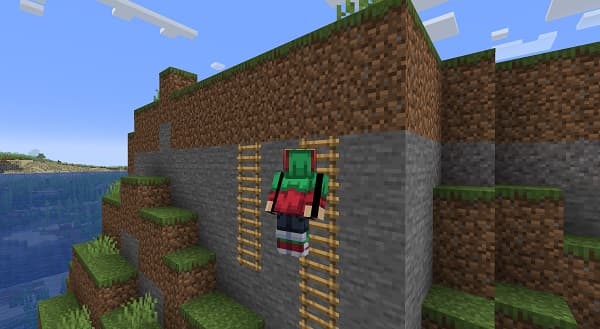 Red poppies in a green field under a clear blue sky.