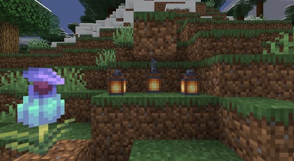 Two young men, one with a beard and one with glasses, laughing together.