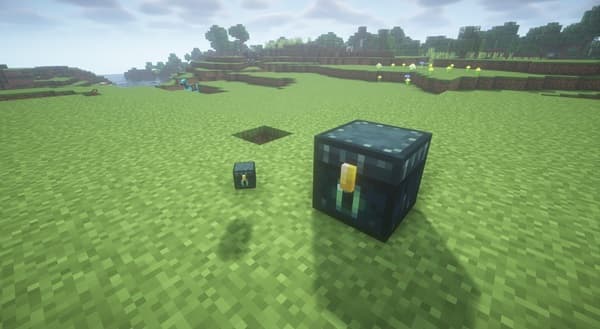 Man in a dark suit sitting at a table.