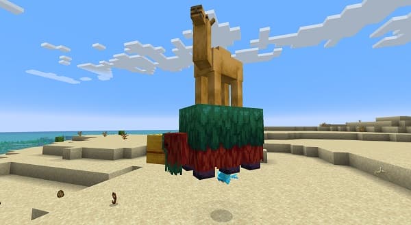 A young woman in a denim jacket and white shirt smiles while holding a large, colorful bouquet of flowers.