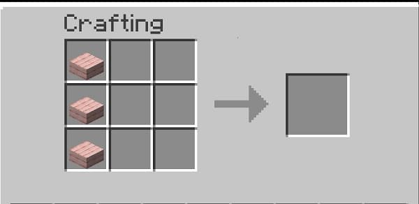 Young woman with wavy hair looking at a smartphone.