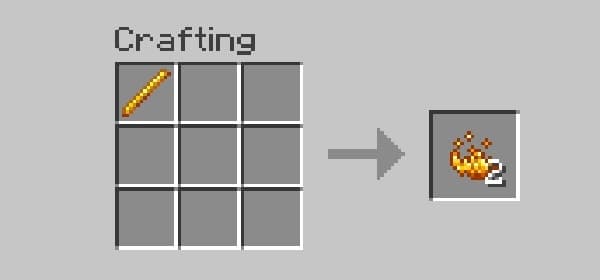 A person in a black shirt and white pants stands on a beach next to a dog, looking out at the ocean.