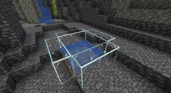 Young woman using a laptop in a modern office space.