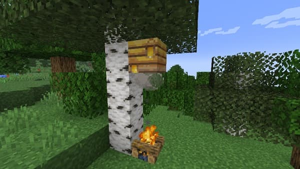 A serene, still lake reflecting a cloudy sky and distant, tree-lined shores under soft light.