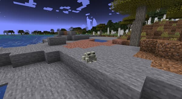 A person's hands holding a smartphone displaying a social media feed.