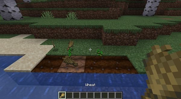 A black, red, and white robot arm extending.