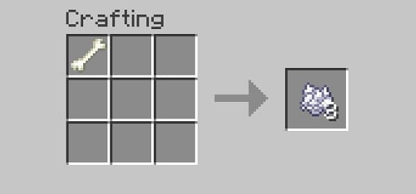 A serene, empty green meadow under a clear blue sky.