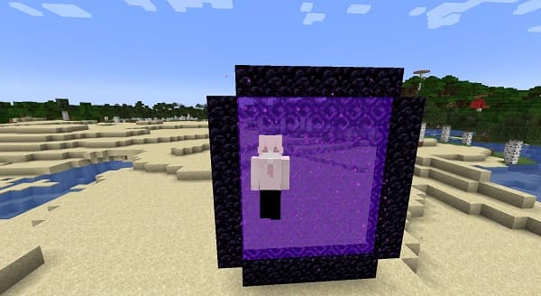 A black and white photo of a man and a woman in formal wear, embracing and smiling at the camera.