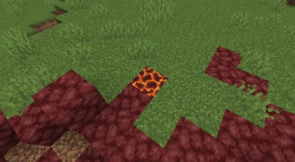 Empty office desk with a laptop and plant.