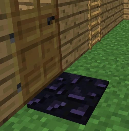 Woman smiling while working on her laptop in a modern office.