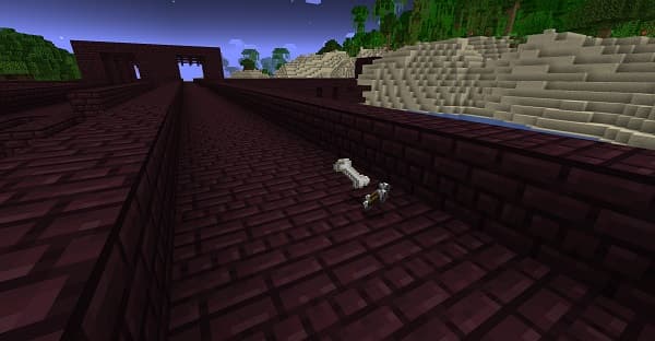 Close-up of a laptop keyboard with illuminated keys in a dim room.