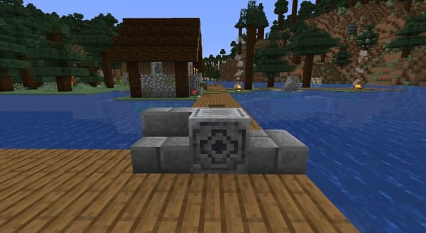 A person using a laptop with an external keyboard and mouse.