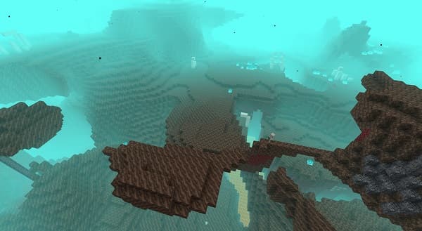 Red brick building with arched windows and a green awning.