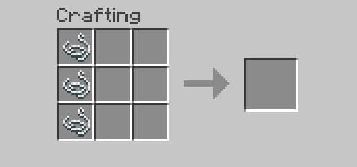 A white dog with a blue leash sitting on a vibrant green lawn.