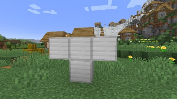 A person stands in a dark forest, illuminated by a glowing light on the ground, creating a mystical atmosphere.