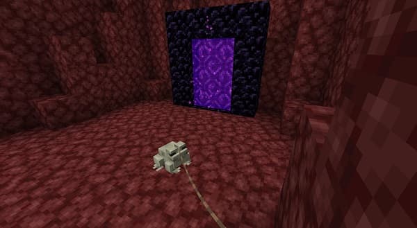 A person using a laptop and smartphone.