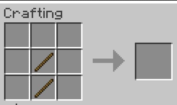 A vintage brass telescope on a wooden tripod, pointing upwards against a blurred background.