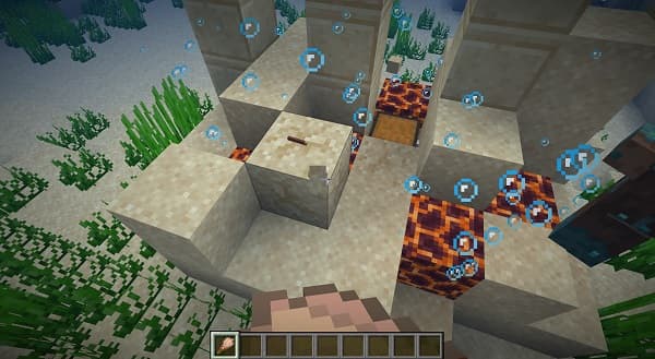 A lone sailboat glides across the calm water at sunset.