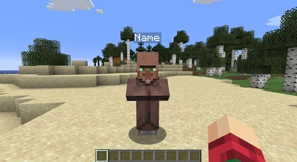 Smiling woman wearing glasses and a striped shirt.