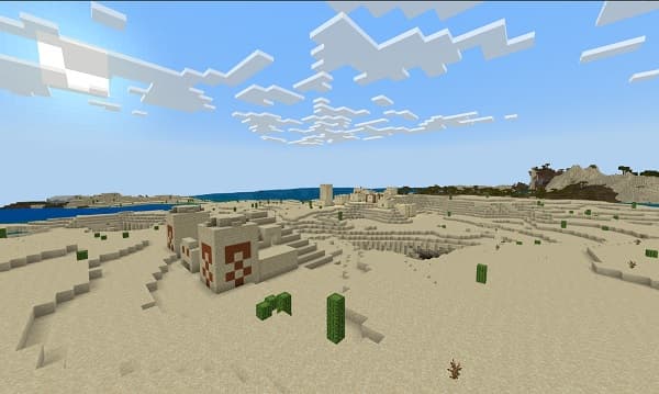 A black dog stands on a white tile floor.