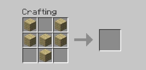 Empty living room with blank white walls and a light wood floor.