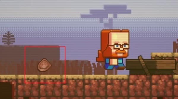 Brown wooden fence in a lush green field under a clear blue sky.