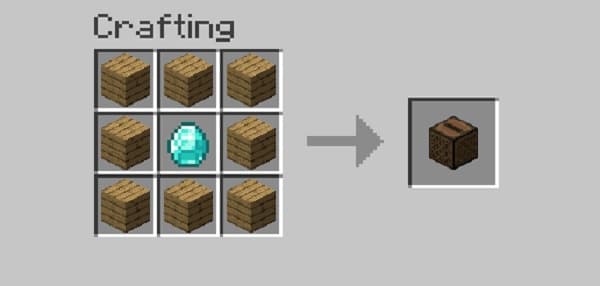 Woman working on laptop at a cafe.