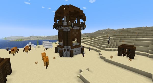 Red wine bottle and two glasses on a wooden table.