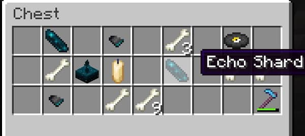 A group of diverse people in a modern office collaborating around a laptop.