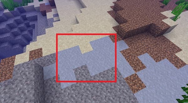 A person's hands holding a smartphone displaying a social media feed.