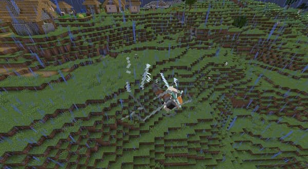 A close-up of a blooming white calla lily with a yellow stamen.