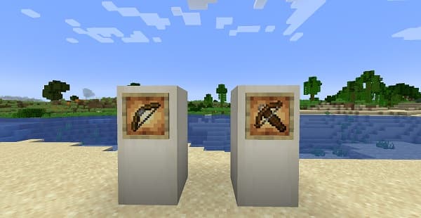 A black laptop and a white smartphone on a desk.