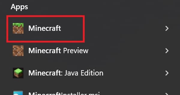 A person's hand typing on a laptop keyboard.