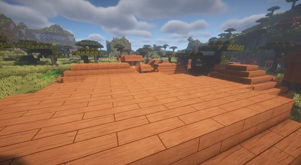 A white dog lying on a brown sofa.