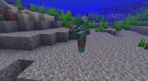 A person's hand pressing a button on a control panel.