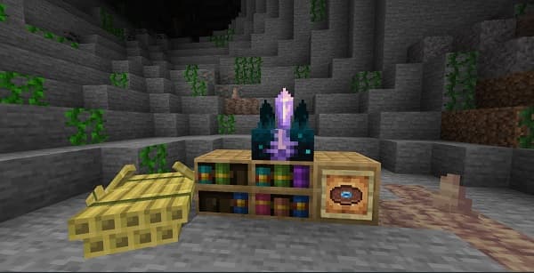 A young man holding a cup and smiling.