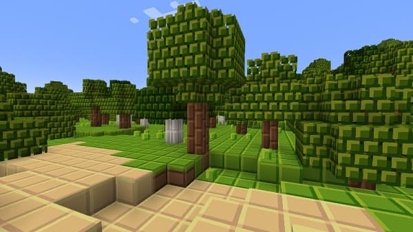 Person on laptop with a view of a city skyline.