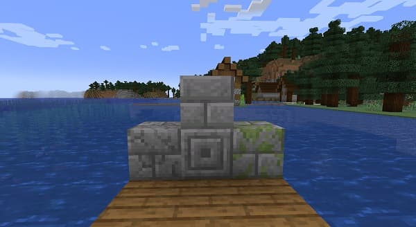 A young boy with a concerned expression sits at a school desk.