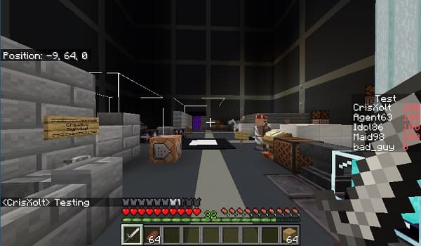 A fluffy white dog with floppy ears rests on a comfy dog bed.