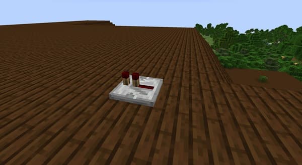 A person holding a small, empty, clear plastic bag.