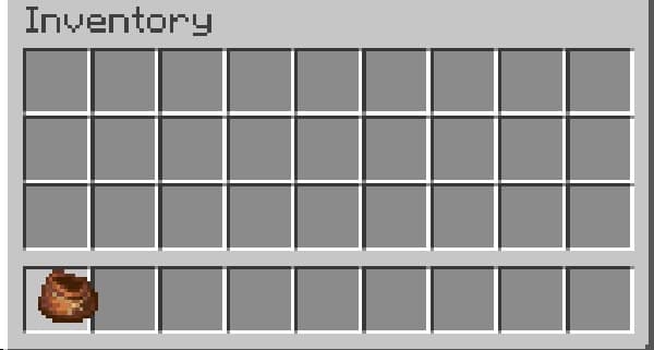 A person stands at a laptop, writing.