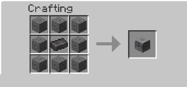 Old, ornate bronze key with intricate details on a wooden surface.