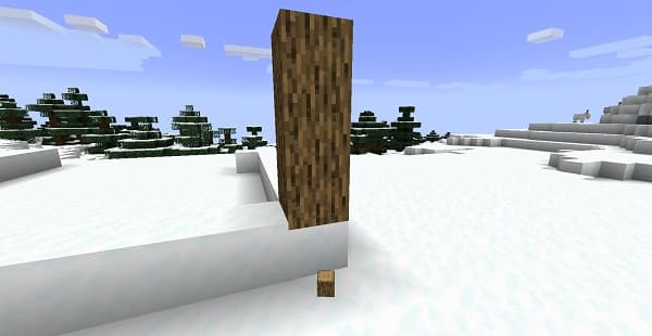 A brown wooden cutting board with a knife and sliced vegetables.