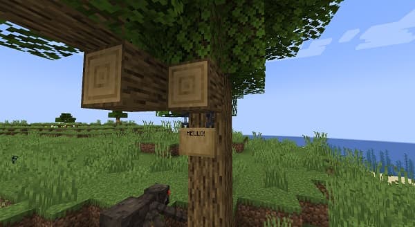 An older woman sitting on a park bench.