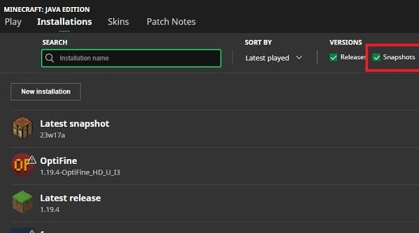 A young woman sits thoughtfully on a porch swing, looking out at a peaceful garden.