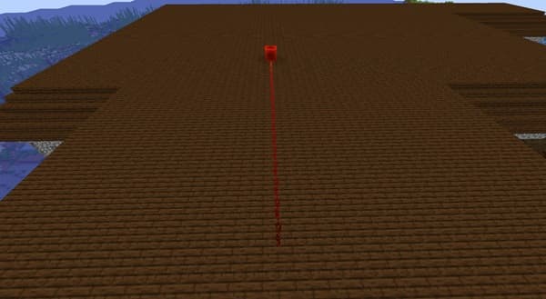 Smiling woman in blue jacket enjoying a cup of coffee.