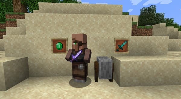 Man looking out from a snowy mountain peak at sunset.